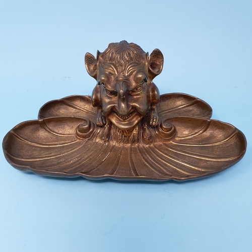 356 - A novelty brass inkwell, in the form of a devil type figure, 22.5 cm wide, removal cost A