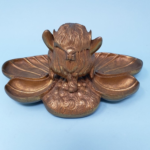 356 - A novelty brass inkwell, in the form of a devil type figure, 22.5 cm wide, removal cost A