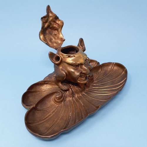 356 - A novelty brass inkwell, in the form of a devil type figure, 22.5 cm wide, removal cost A