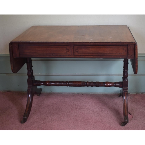 357 - A Regency inlaid mahogany sofa table, having two frieze drawers, on ring turned and baluster end sup... 