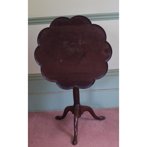 358 - A George III mahogany tripod table, the dished lobed top on a birdcage support, a tapering column an... 