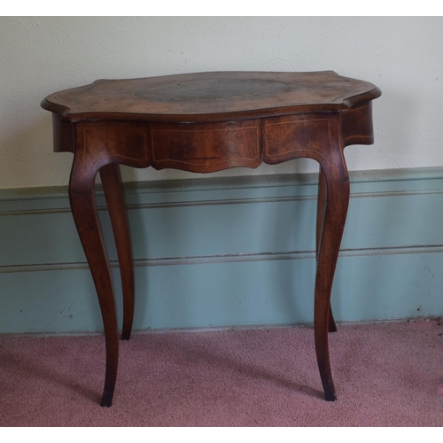 365 - A late 19th century occasional table, of shaped oval form, veneered in walnut and with floral marque... 