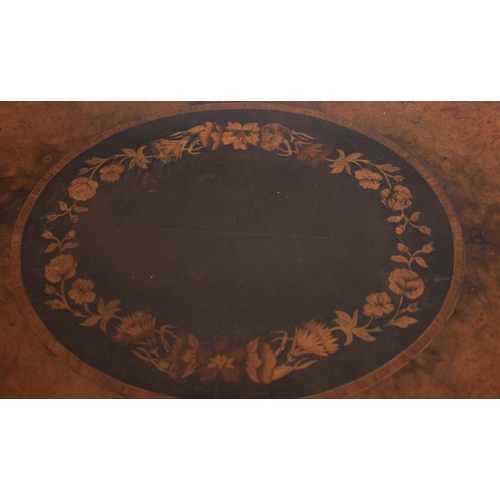 365 - A late 19th century occasional table, of shaped oval form, veneered in walnut and with floral marque... 