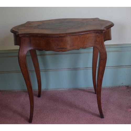 365 - A late 19th century occasional table, of shaped oval form, veneered in walnut and with floral marque... 