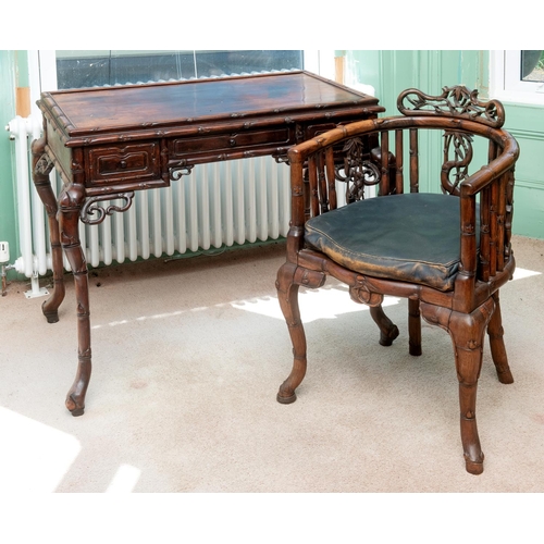 366 - A Chinese hardwood desk, with simulated bamboo decoration, having three frieze drawers, on shaped ba... 