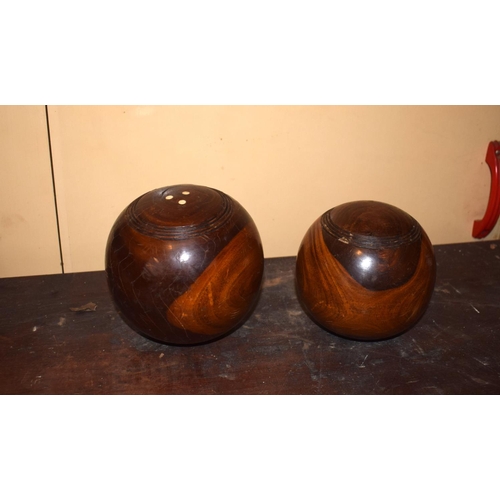 40 - Nine lignum vitae lawn bowls, in a pine box, 48.5 cm wide, removal cost A