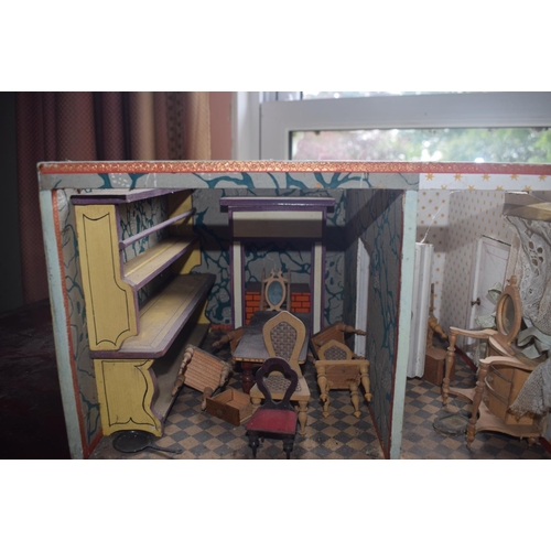 121 - A late 19th/early 20th century three storey doll's house, No 5, with a large group of assorted furni... 