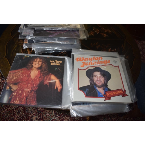 144 - A large quantity of assorted 33 rpm records, including country and western, film and others, a group... 