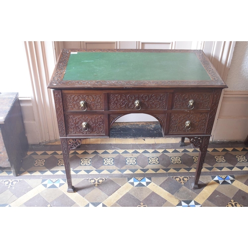 210 - A lowboy/desk, the leatherette inset top above an arrangement of five real and five false drawers, o... 