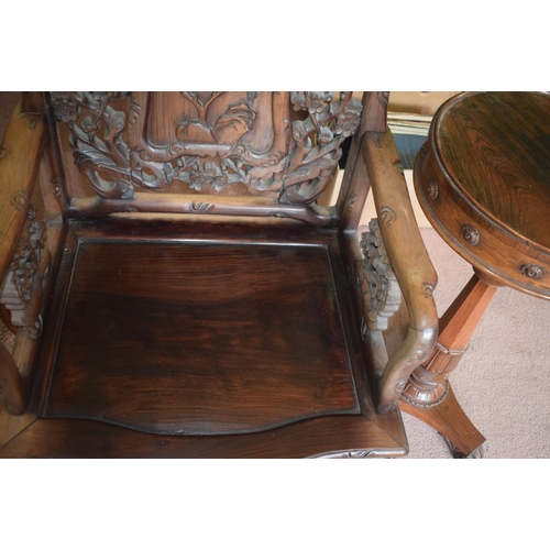 347 - A Chinese hardwood armchair, carved in relief and pierced with birds and blossom, on shaped legs, re... 