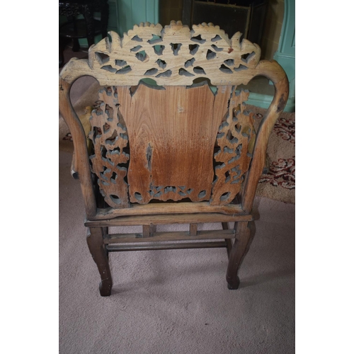 347 - A Chinese hardwood armchair, carved in relief and pierced with birds and blossom, on shaped legs, re... 