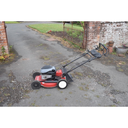 5 - A Mountfield self propelled petrol lawn mower, and a Stihl Wood Boss chain saw (2) removal cost C