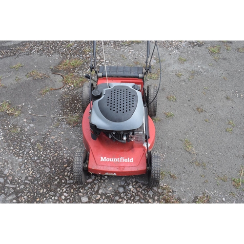 5 - A Mountfield self propelled petrol lawn mower, and a Stihl Wood Boss chain saw (2) removal cost C