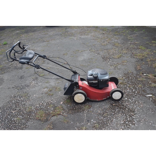 5 - A Mountfield self propelled petrol lawn mower, and a Stihl Wood Boss chain saw (2) removal cost C