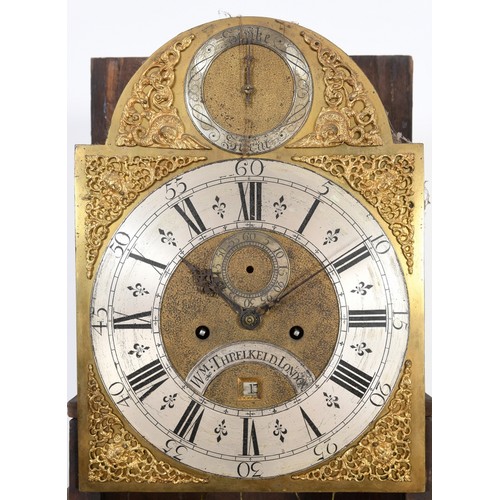 12 - A longcase clock, the 30 cm arched square brass dial signed Wm  Threlkeld, London to a silvered arch... 