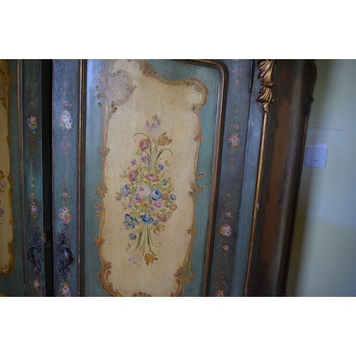 81 - A Continental serpentine front painted two door wardrobe, with panels of flowers and foliage, 140 cm... 