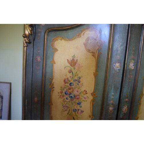 81 - A Continental serpentine front painted two door wardrobe, with panels of flowers and foliage, 140 cm... 