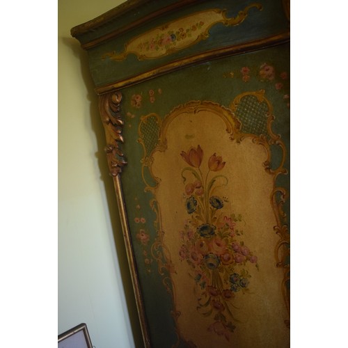 81 - A Continental serpentine front painted two door wardrobe, with panels of flowers and foliage, 140 cm... 