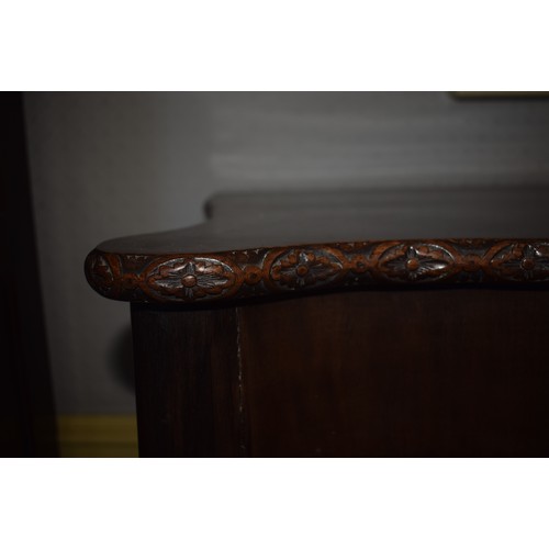 150 - An 18th century style Chippendale serpentine front table, on carved cabriole legs with claw and ball... 