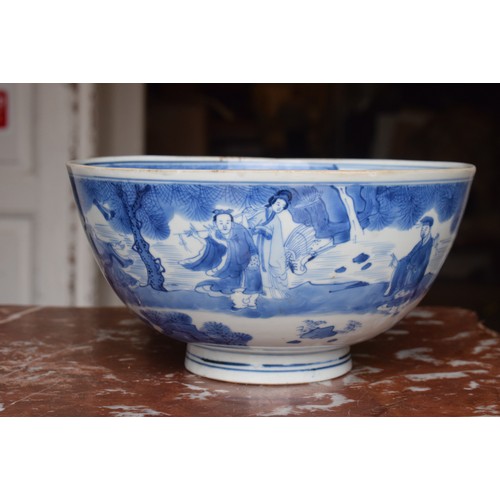 301 - A Chinese bowl, decorated figures in underglaze blue, six character mark to base, 21 cm diameter, re... 