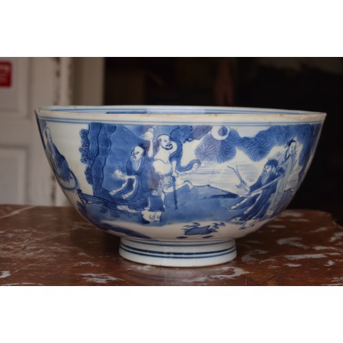 301 - A Chinese bowl, decorated figures in underglaze blue, six character mark to base, 21 cm diameter, re... 