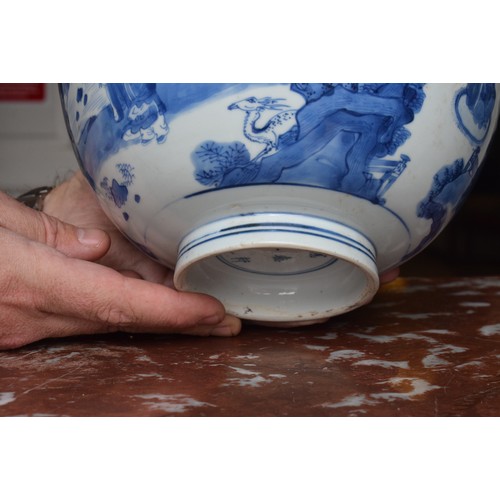 301 - A Chinese bowl, decorated figures in underglaze blue, six character mark to base, 21 cm diameter, re... 