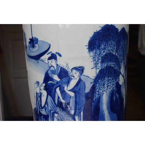 309 - A Chinese rouleau vase, decorated a man breathing fire with a dragon and other figures in underglaze... 