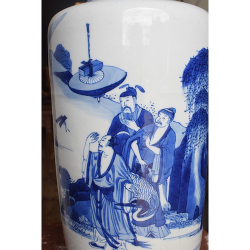 309 - A Chinese rouleau vase, decorated a man breathing fire with a dragon and other figures in underglaze... 