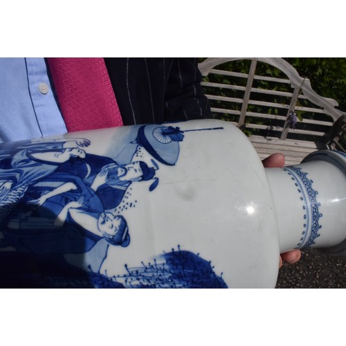 309 - A Chinese rouleau vase, decorated a man breathing fire with a dragon and other figures in underglaze... 