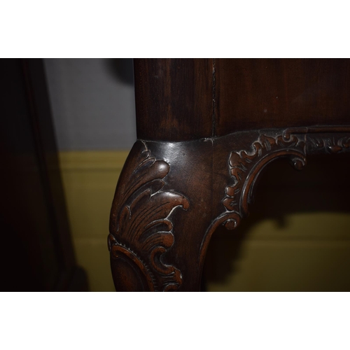 150 - An 18th century style Chippendale serpentine front table, on carved cabriole legs with claw and ball... 