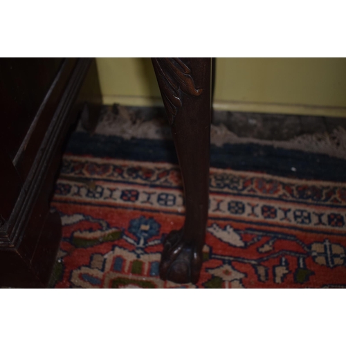 150 - An 18th century style Chippendale serpentine front table, on carved cabriole legs with claw and ball... 