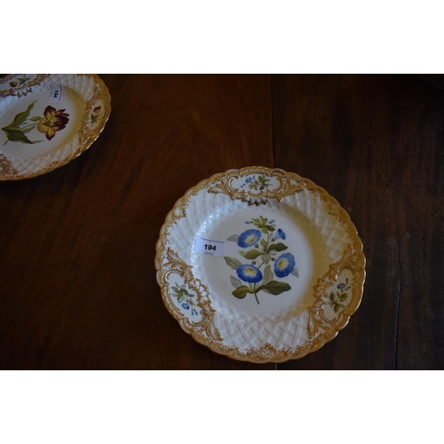 194 - A 19th century botanical part dessert service, decorated with flowers, highlighted in gilt, comprisi... 