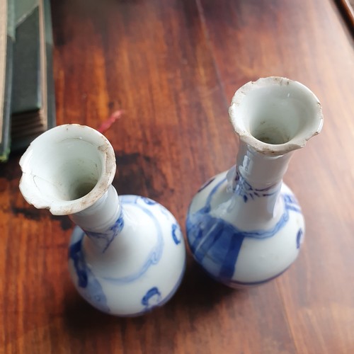 296 - A pair of Chinese blue and white vases, decorated figures, 16 cm high, removal charge A