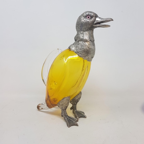 15 - A modern silver plated and amber glass claret jug, in the form of a duck, 28 cm high