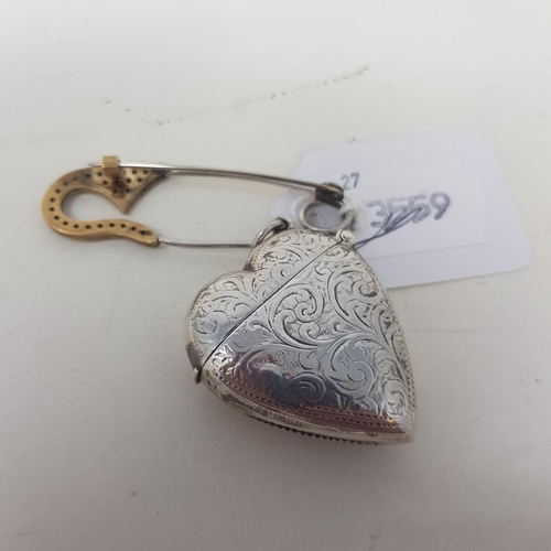 96 - A modern silver coloured metal novelty vesta, in the form of a heart, and a pin (2)