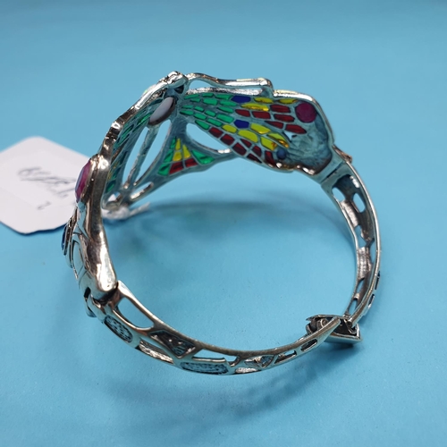 173 - A modern silver coloured metal enamel dragonfly bangle