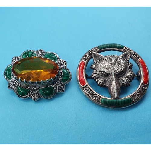 222 - A modern silver coloured metal brooch, inset with a yellow stone, another, embossed with a fox head ... 