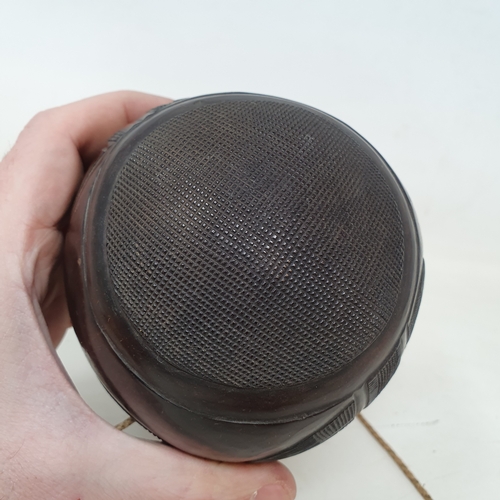 646 - A carved coconut bugbear flask, 14 cm wide