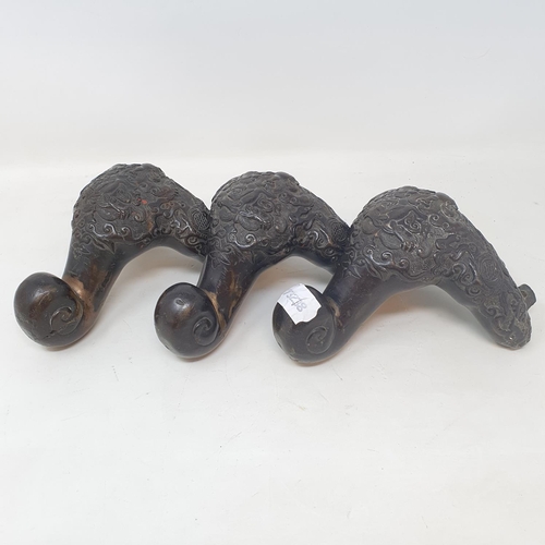 649 - A set of three Chinese bronze feet, decorated mythical beasts and foliage, 16 cm (3)