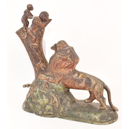 652 - A painted cast metal novelty money box, in the form of a monkey and infant feeding a lion, 24 cm hig... 