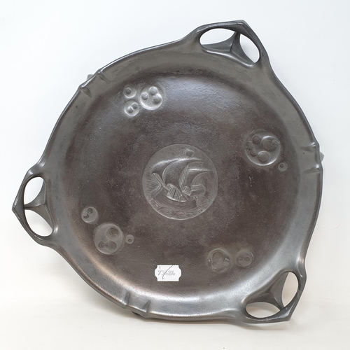 664 - An Art Nouveau Kayzerzin pewter stand, with central roundel embossed with galleons, 36 cm diameter