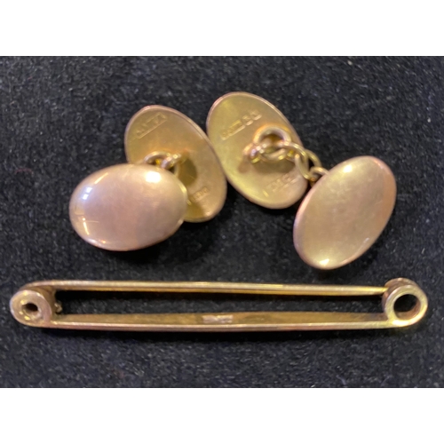 147 - A pair of 9ct gold cufflinks, and a 9ct gold bar brooch, 6.5 g