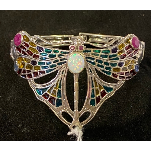 173 - A modern silver coloured metal enamel dragonfly bangle