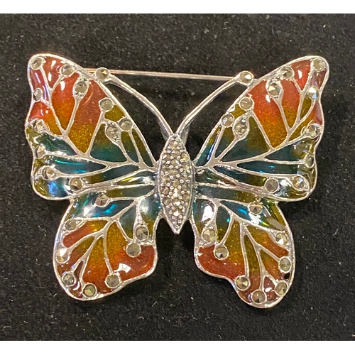 187 - A silver butterfly brooch/pendant with marcasite