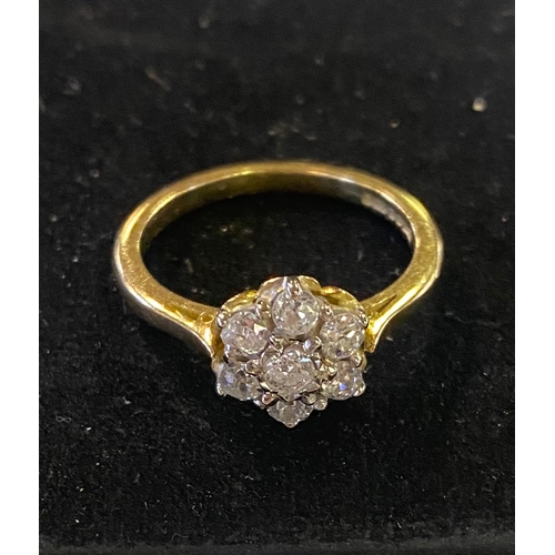 231 - An 18ct gold and diamond flowerhead ring, approx. ring size O, 4.1 g (all in)