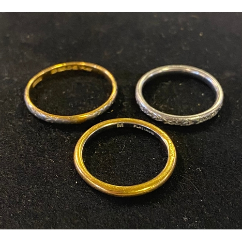 252 - A 22ct gold wedding band, 2.4 g, a platinum wedding band, 3.9 g, and a platinum and 22ct gold weddin... 
