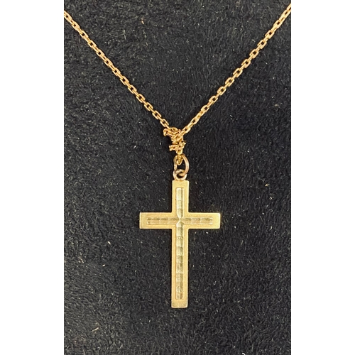 352 - A yellow coloured metal cross and chain