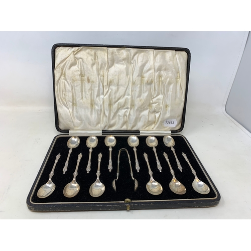 7 - A set of twelve silver teaspoons, with matching sugar tongs, having apostle finials, Sheffield 1927,... 