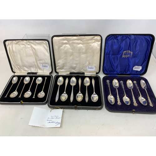 8 - A set of six silver teaspoons, in a Harrods case, another set similar, and a set of six silver coffe... 