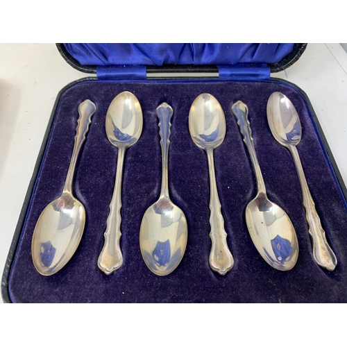 8 - A set of six silver teaspoons, in a Harrods case, another set similar, and a set of six silver coffe... 